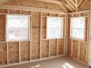 10x12 Custom Victorian Deluxe Storage Shed interior with additional windows